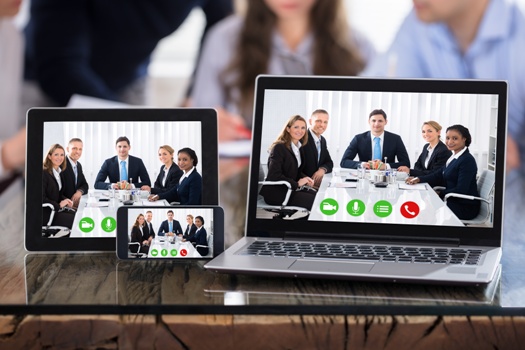 Video Conferencing On Modern Electronic Devices Over The Office Desk